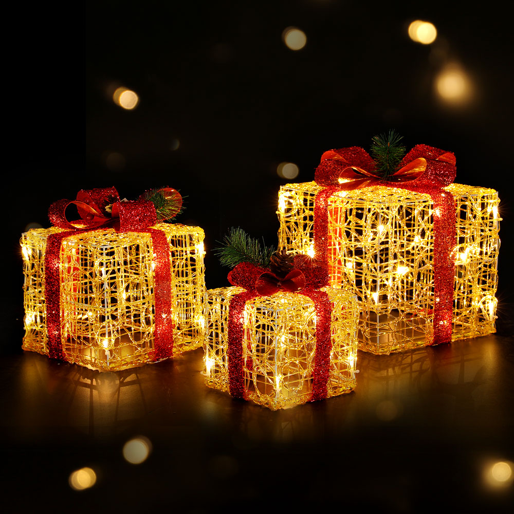 Set of three Christmas gifts in lights
