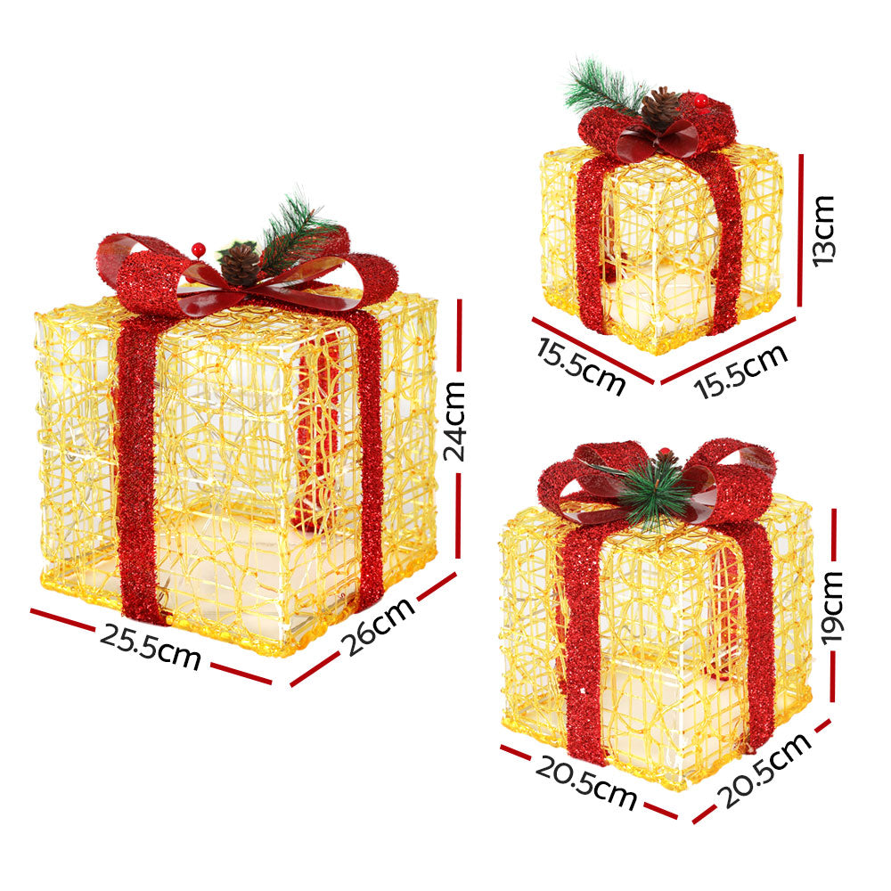 Set of three Christmas gifts in lights