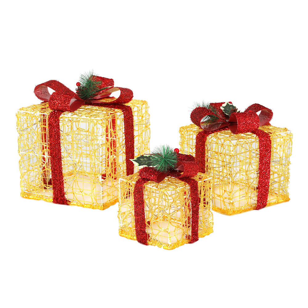 Set of three Christmas gifts in lights