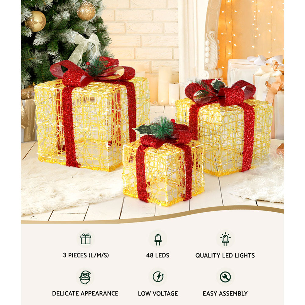 Set of three Christmas gifts in lights