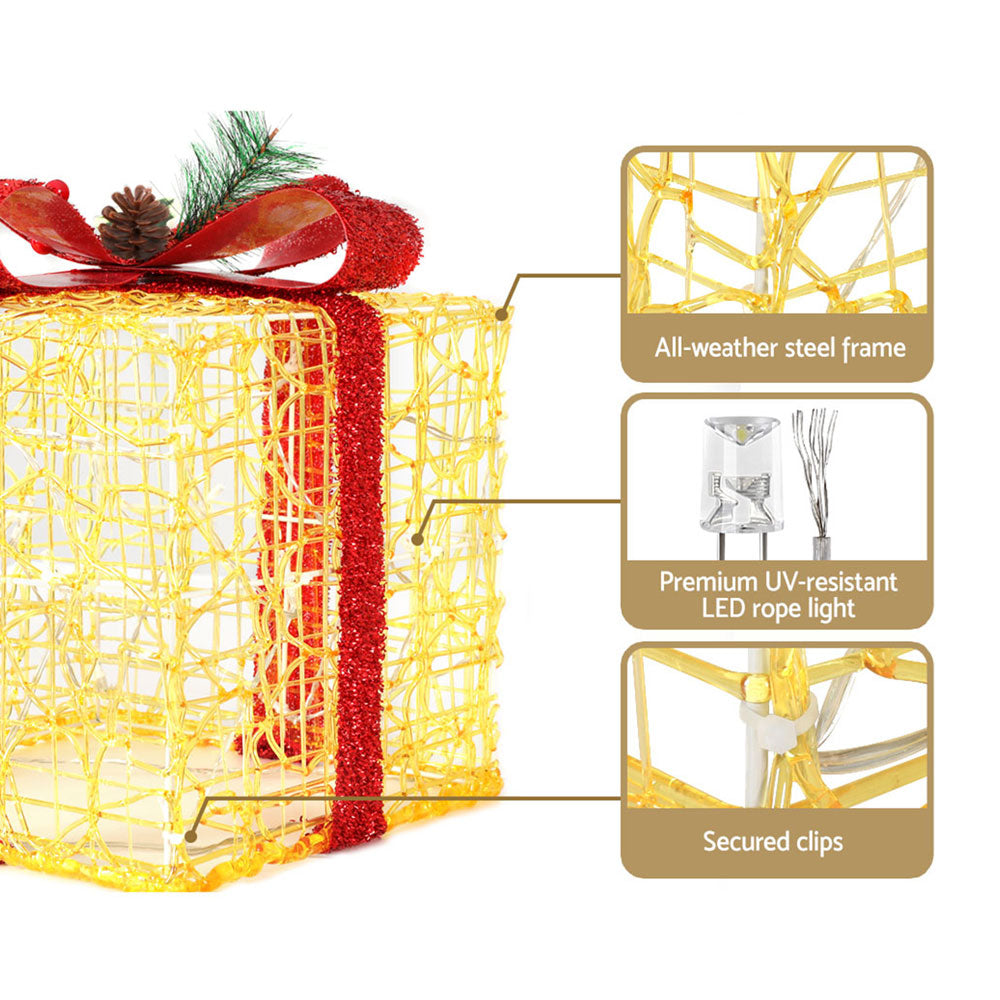 Set of three Christmas gifts in lights